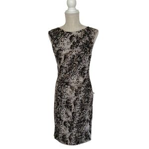 Size small cache animal print  knee length dress with golden accent zippers